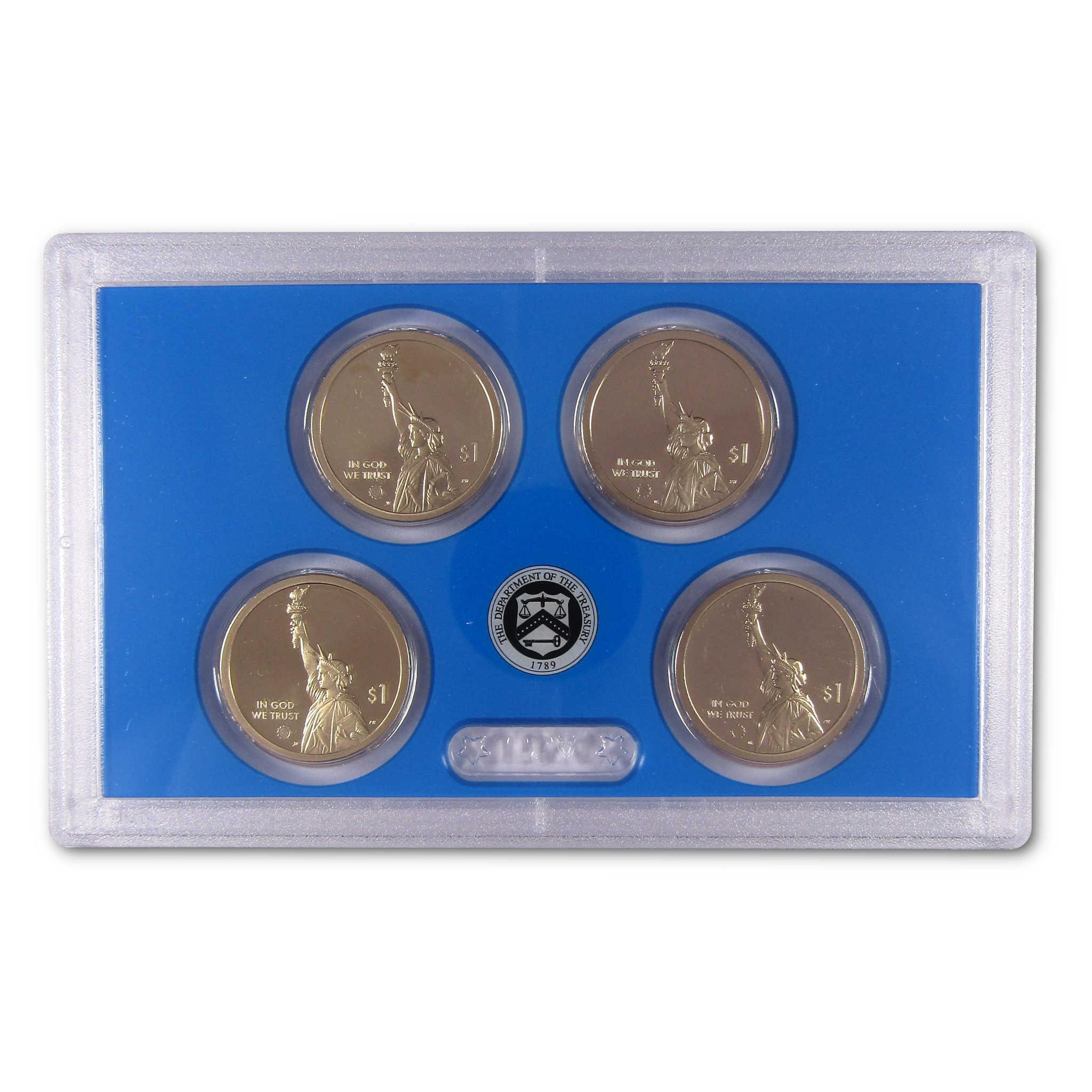 Four collectible $1 coins with Statue of Liberty design in a blue plastic display case.