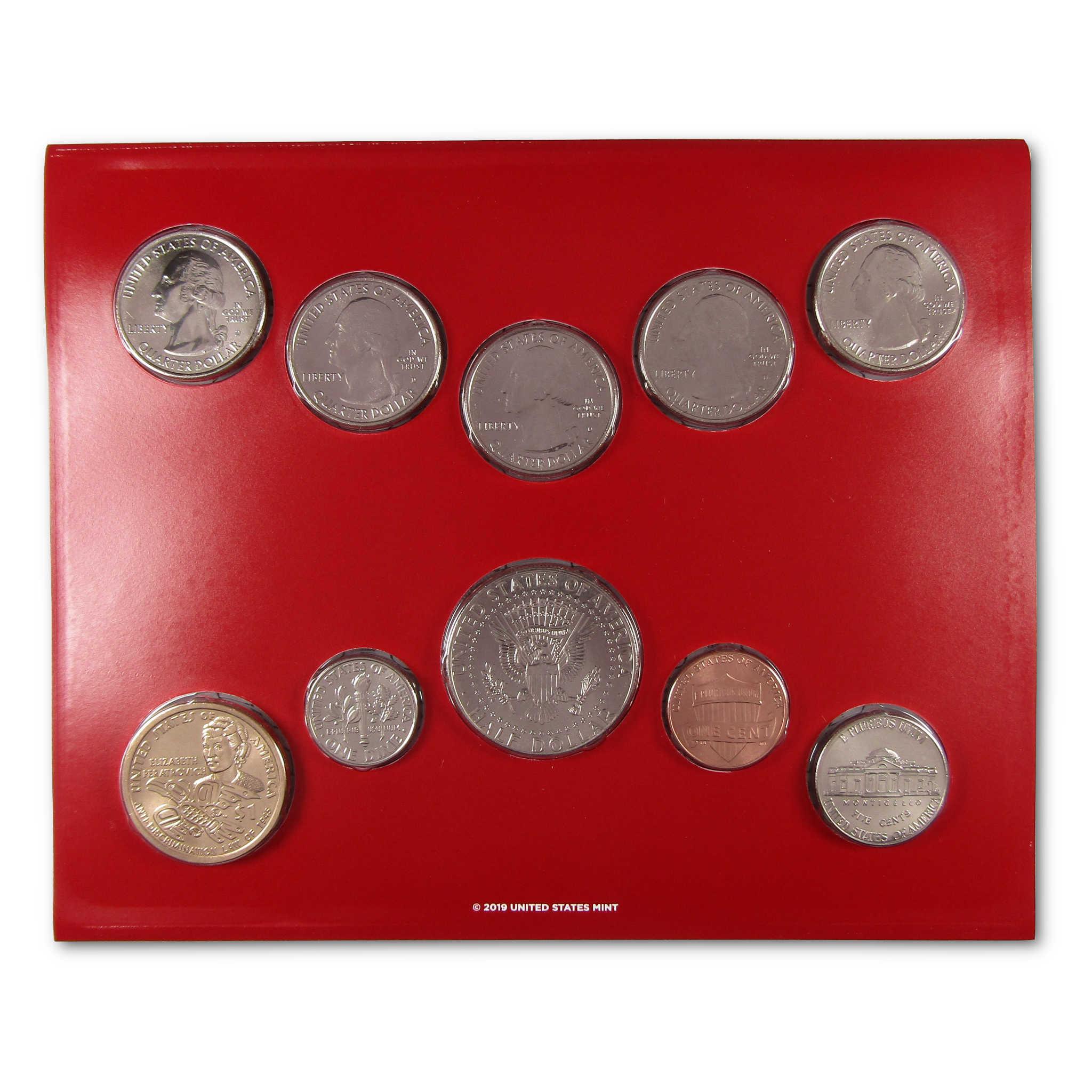 United States coin set displayed in red holder, featuring quarters, dollar, penny, and half dollar coins.