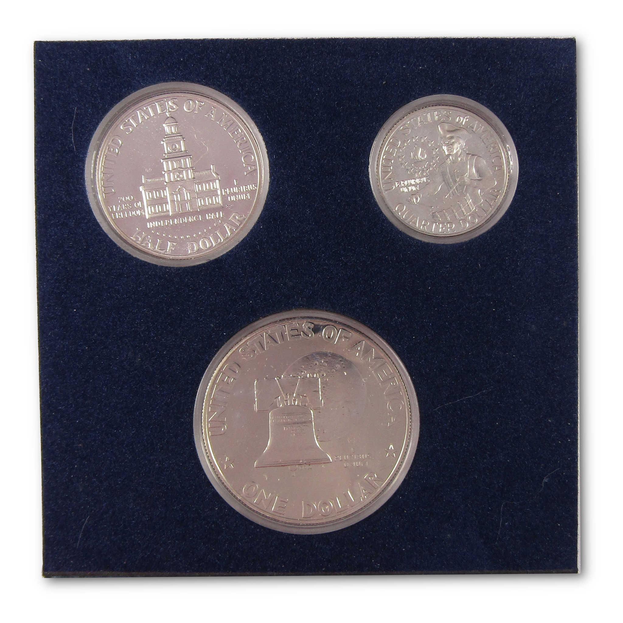 Collectible U.S. coin set with Liberty Bell and historical building designs in display case