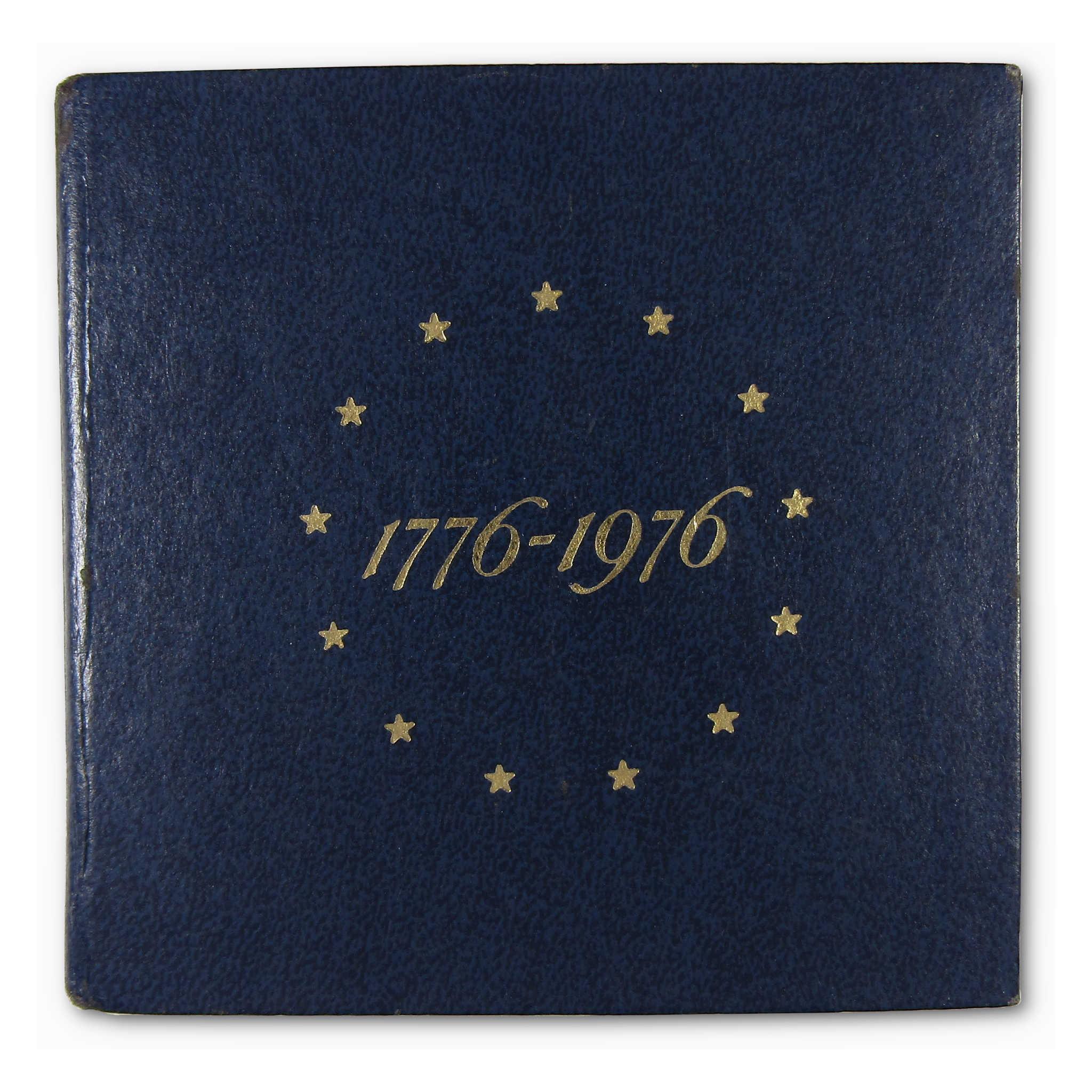 Bicentennial coin set folder with gold stars and 1776-1976 text on blue cover