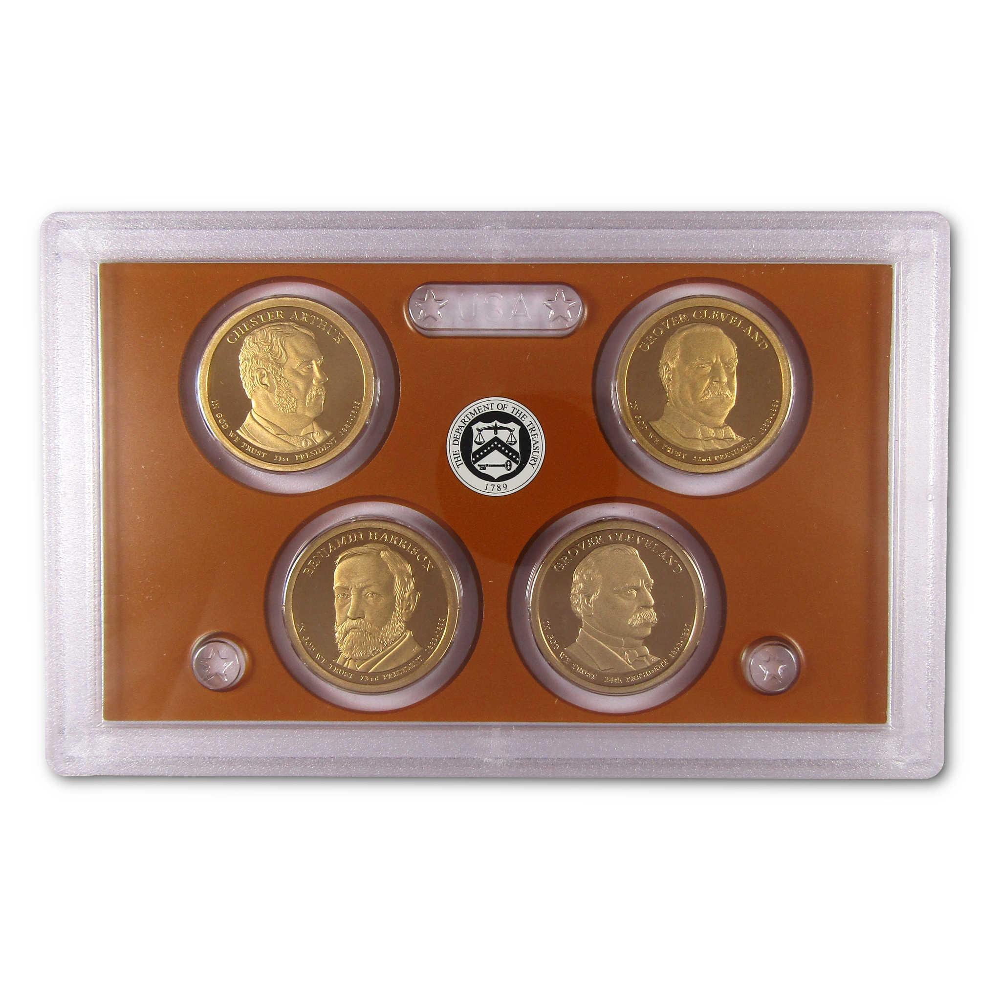 Four collectible presidential coins in protective display case, U.S. Mint emblem visible