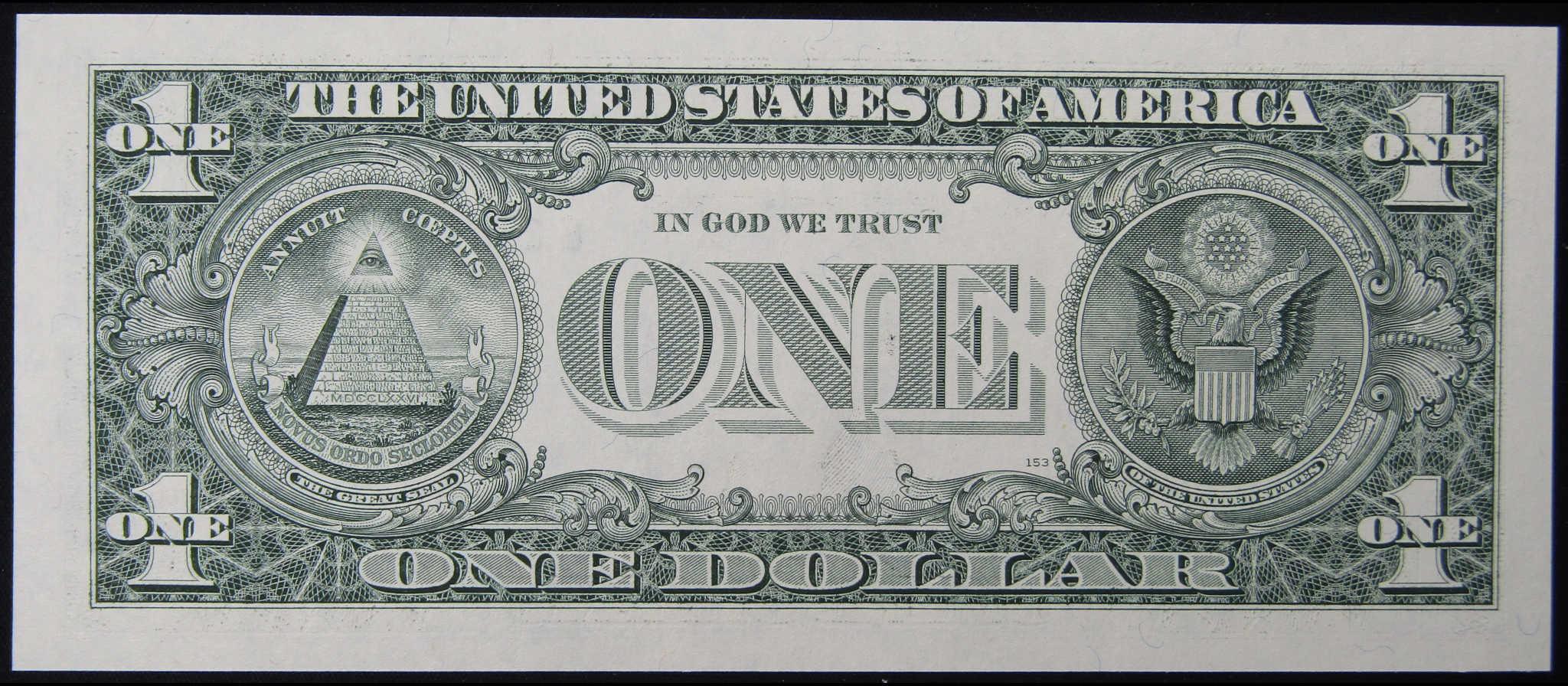Reverse side of collectible US one dollar bill with eagle and Great Seal design