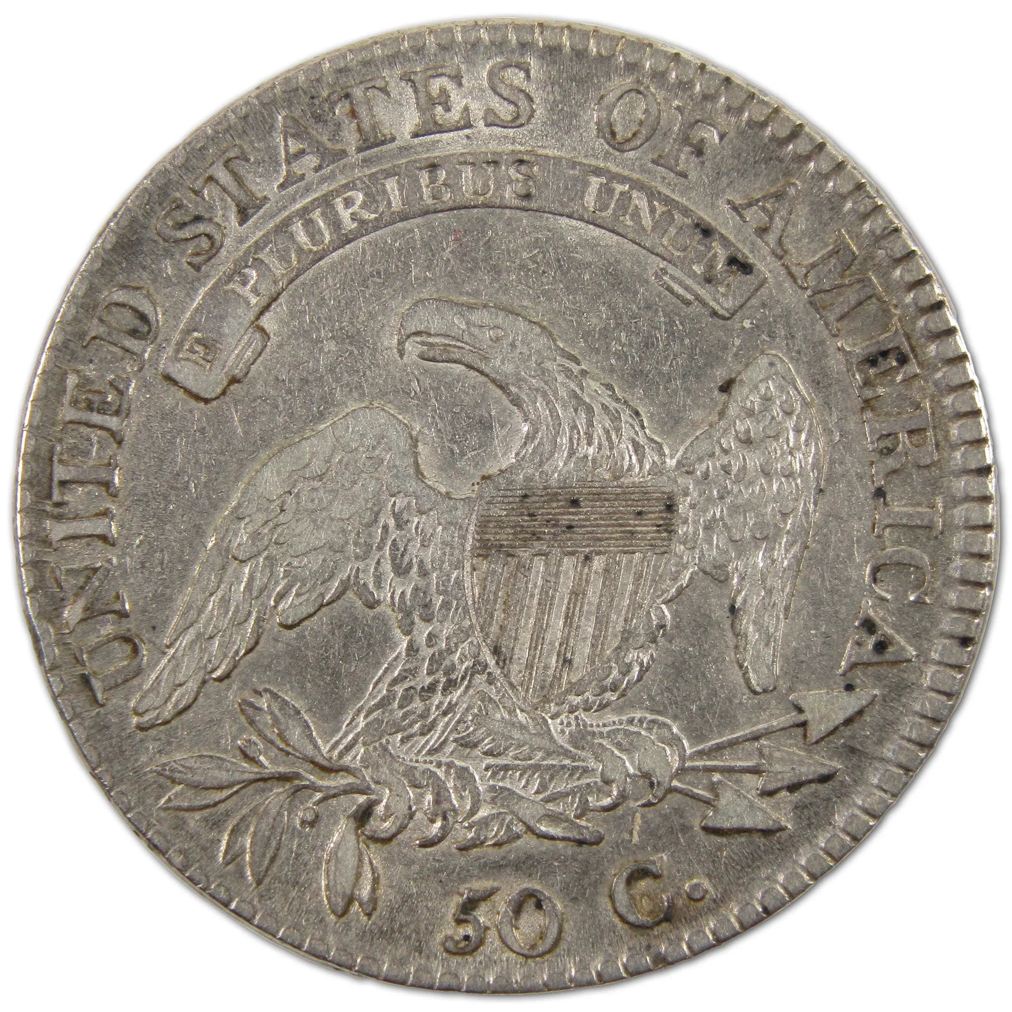 Vintage US half dollar coin with eagle, shield, olive branch, and arrows design